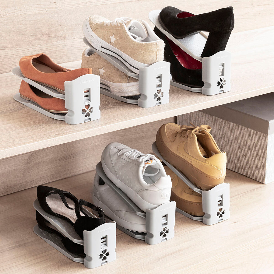 Organizador de zapatos Sholzzer con seis soportes regulables sujetando zapatillas en vertical